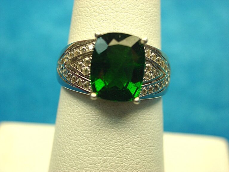 Sterling silver ring with emerald green stone and diamonds, size 7