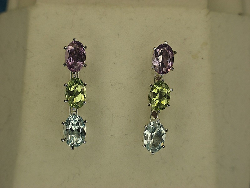 Sterling silver dangle earrings with amethyst, tanzanite, and sapphire gemstones.