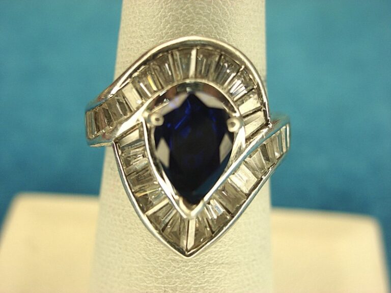 Sterling silver ring with pear-shaped blue gemstone and DQCZ baguettes, size 6.5