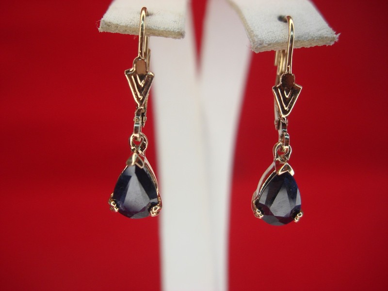 Sterling silver dangle earrings with dark blue topaz stones
