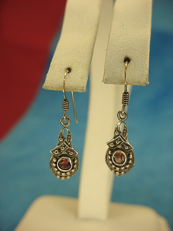 Sterling silver dangle earrings with red gemstones
