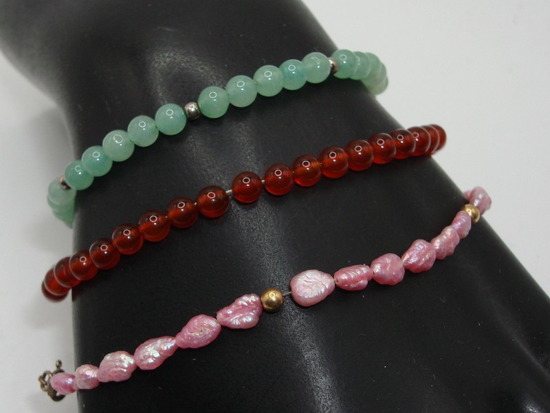 Vintage gold-filled gemstone bracelet set featuring garnet, jadeite, and freshwater pearls