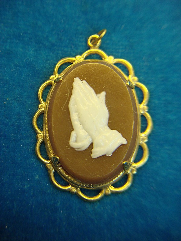 Vintage gold tone lucite pendant charm with praying hands design