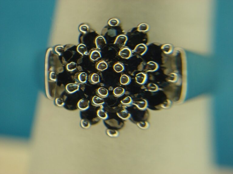 Elegant sterling silver ring with a dark blue topaz gemstone, size 6 3/4