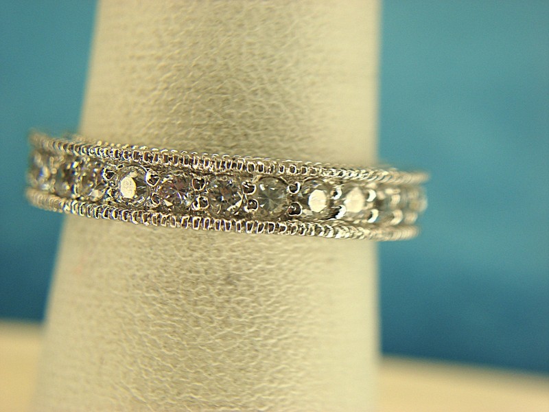 Sterling silver band ring with round simulated diamonds, size 7