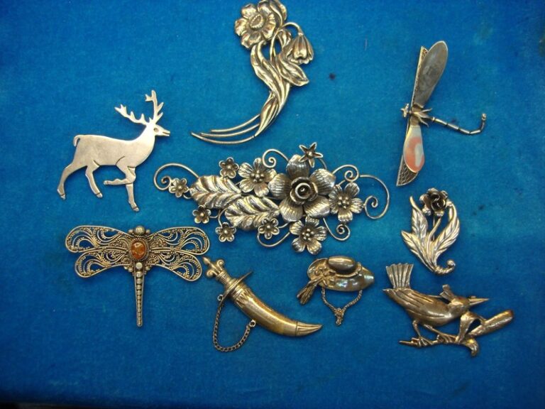 Estate lot of nine (9) authentic sterling silver pins, weighing 113g and valued at $250+