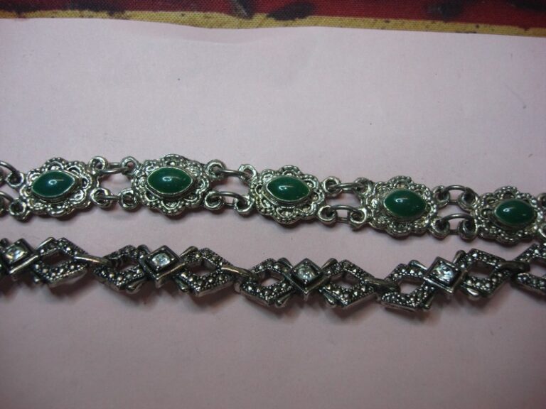Pair of vintage bracelets with sparkling rhinestones and vibrant green enamel