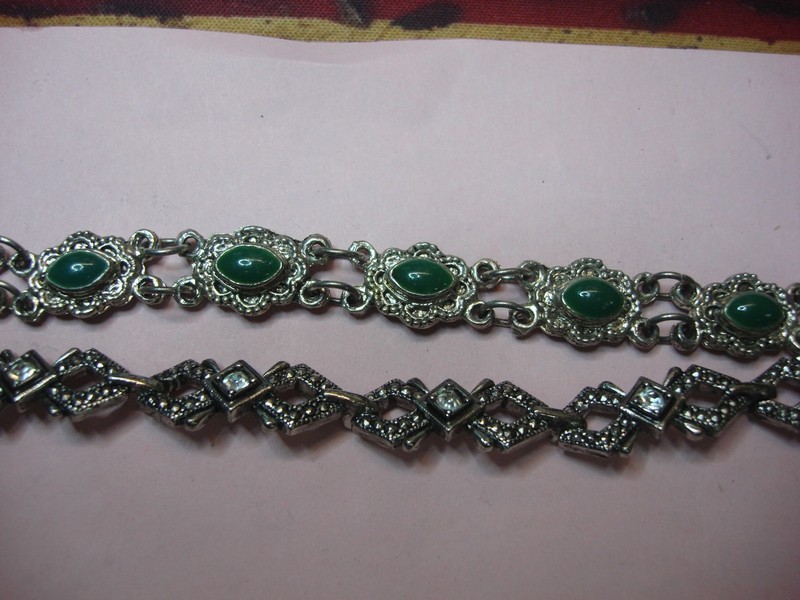 Pair of vintage bracelets with sparkling rhinestones and vibrant green enamel