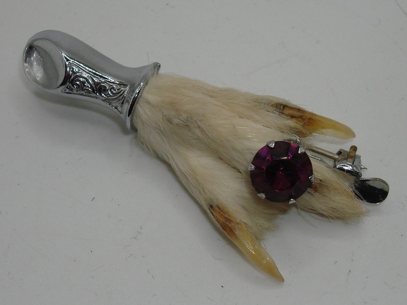 Vintage Celtic grouse foot brooch with amethyst glass gemstone