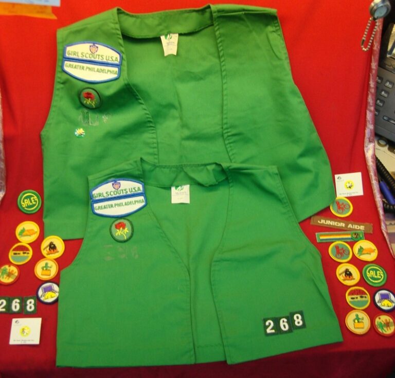 Girl Scouts vests, lot of 2, sizes 10 and 14, with achievement awards and year pins