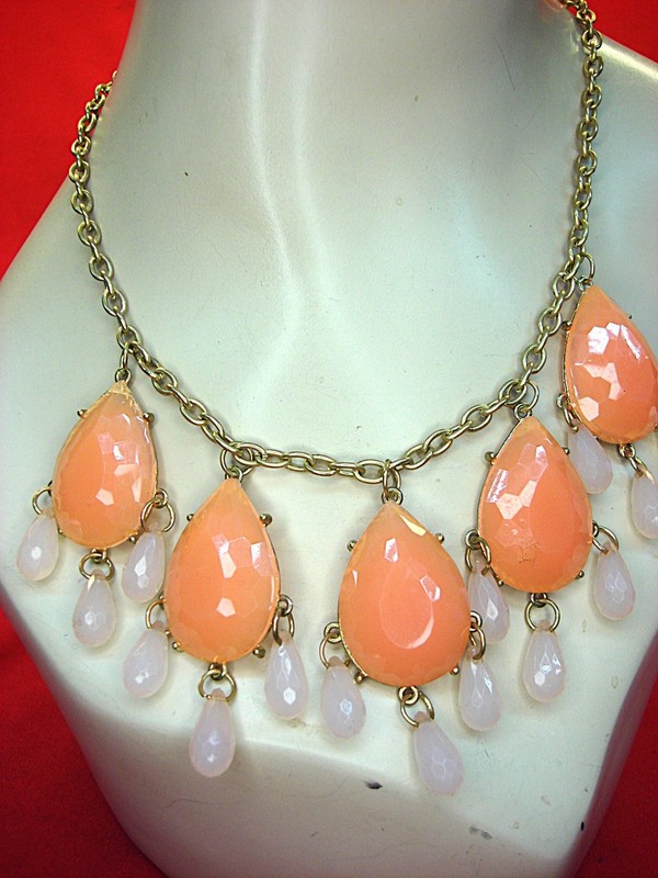Vintage gold tone necklace with peach and pink pear-shaped stones, adjustable length