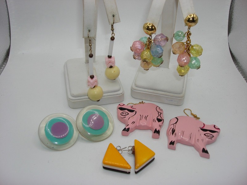 Set of five pairs of vintage pierced earrings from the 1970s and 1980s, including pig, beaded, and lucite styles.