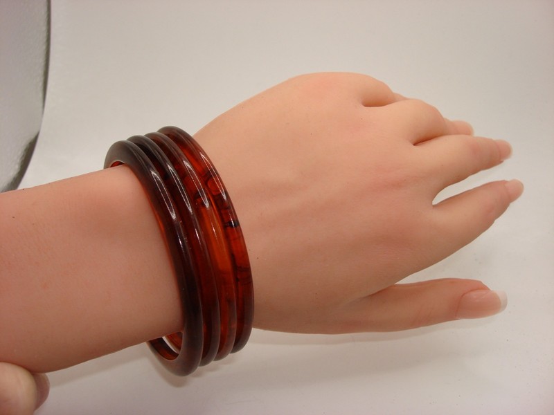 Set of four vintage rootbeer lucite bangle bracelets from the 1960s-70s