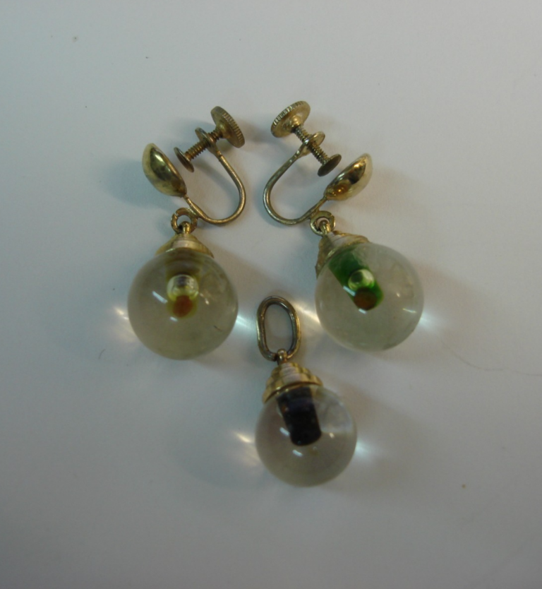 Vintage Coro mustard seed lucite dangle earrings and pendant set from the 1960s