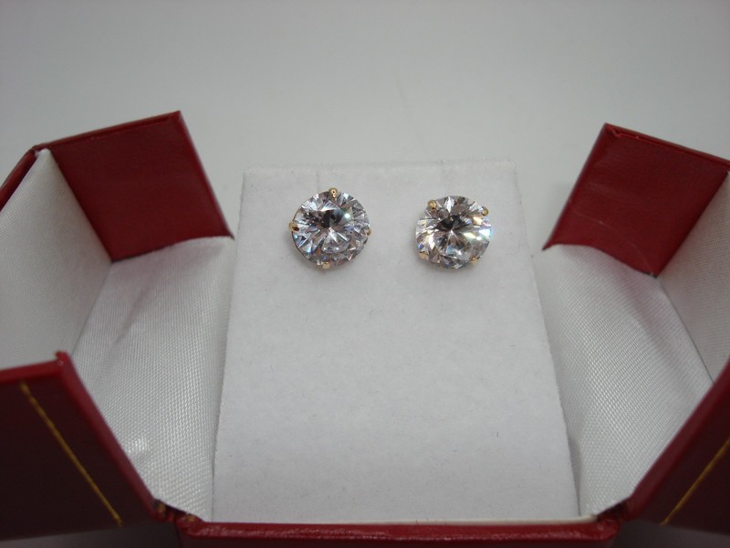 Pair of elegant 14K gold stud earrings with cubic zirconia stones