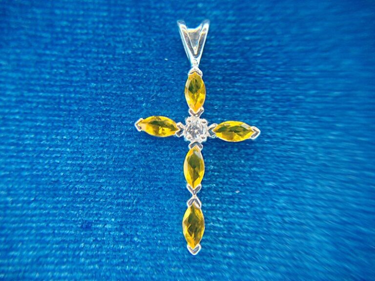 Sterling silver cross pendant with yellow stones and simulated diamond