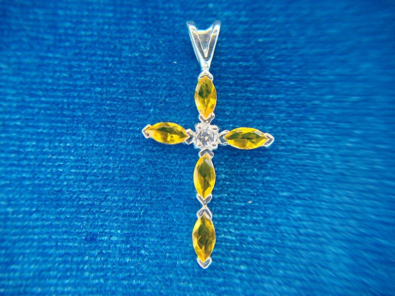 Sterling silver cross pendant with yellow stones and simulated diamond