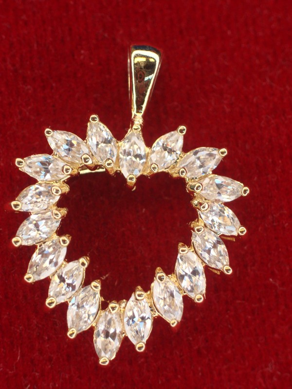 Sparkly sterling silver and gold vermeil heart pendant with cubic zirconia stones