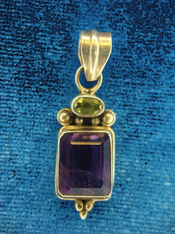 Vintage sterling silver pendant with marquise-cut amethyst and green stone