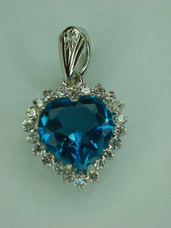 Sterling silver heart pendant with blue pear gemstone and cubic zirconia accents