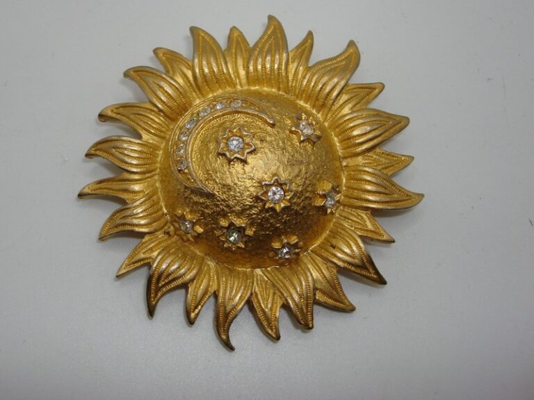 Vintage 1980s gold tone sun and moon pin brooch with cubic zirconia accents