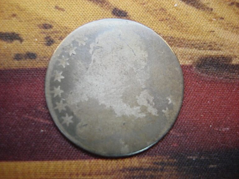 Antique US Bust Half Dollar coin from the 1800s with a worn date