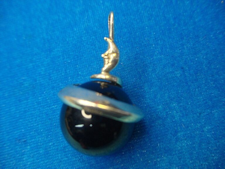 Sterling silver and onyx moon pendant with unique caricature design