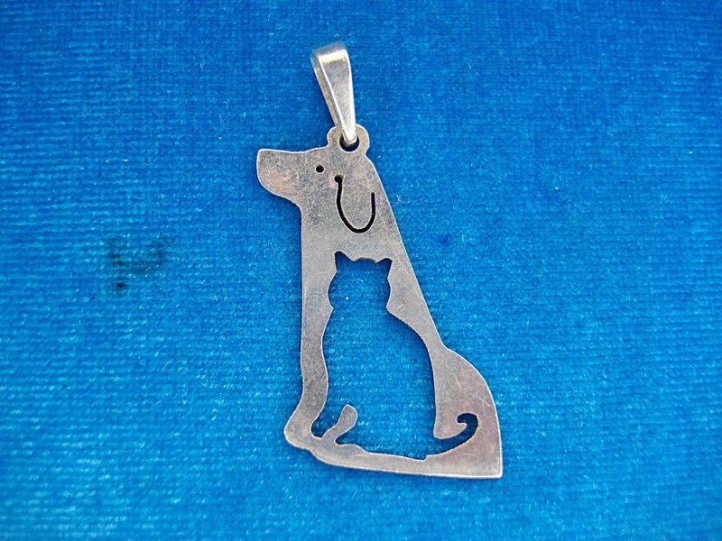 Sterling silver dog and cat pendant with unique silhouette design