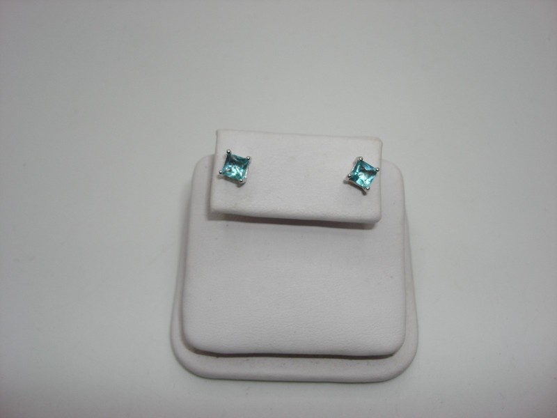 Sterling silver stud earrings with blue topaz gemstones