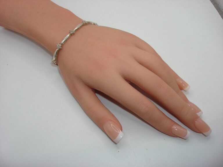 Vintage sterling silver DQ CZ tennis bracelet with sparkling cubic zirconia stones.