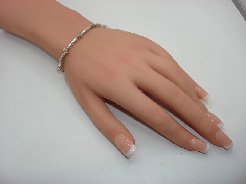 Vintage sterling silver DQ CZ tennis bracelet with sparkling cubic zirconia stones.