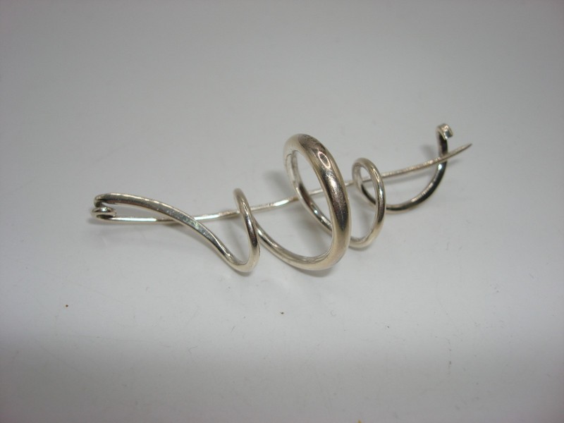 Vintage signed sterling silver swirl pin by JJ STERLING