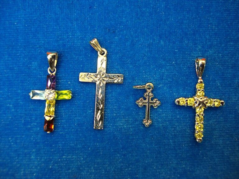Four unique sterling silver cross pendants in vintage style.