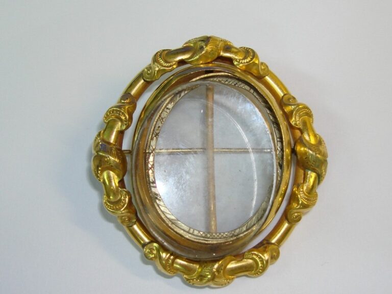 Antique Victorian gold-filled double locket brooch with beveled glass photo holders