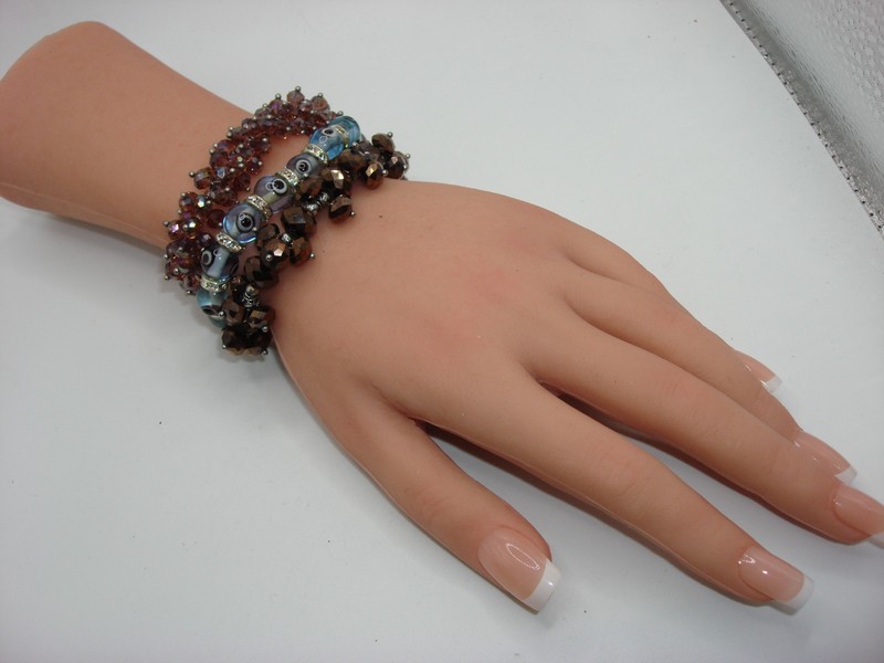 Set of 3 vintage beaded bracelets featuring amethyst, amber, and evil eye designs