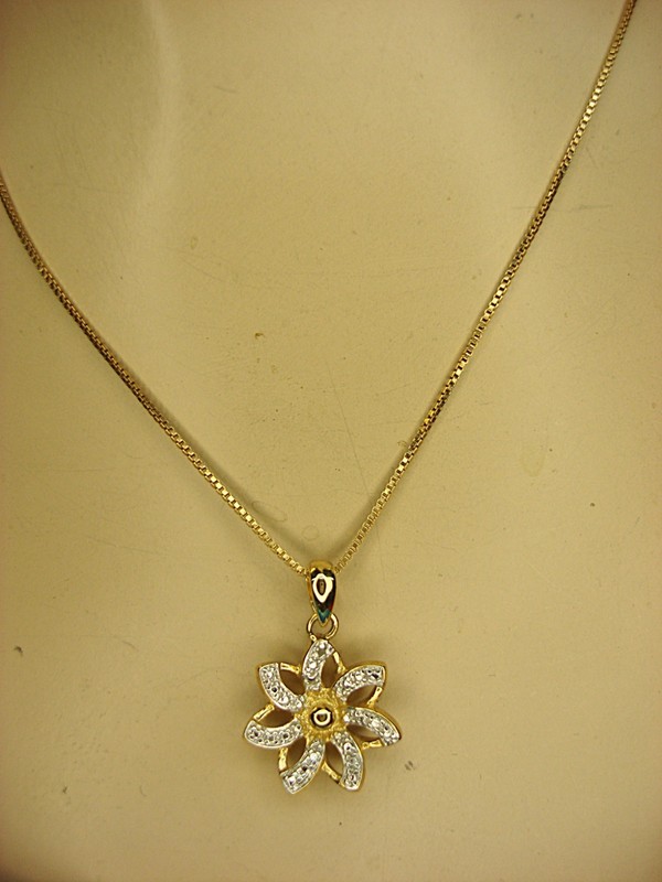 Sterling silver flower necklace with gold vermeil pendant