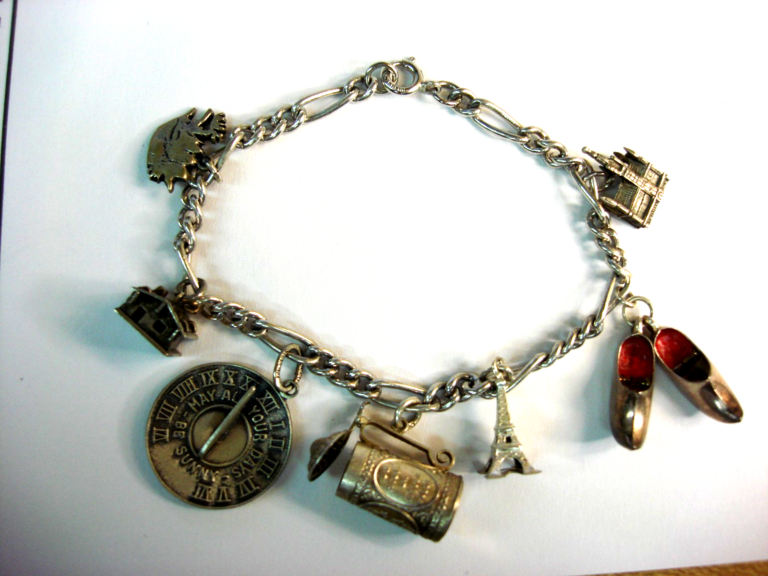 Vintage sterling silver European charm bracelet with seven charms