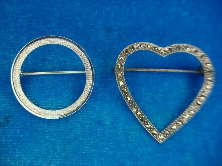 Sterling silver pin set with a circle and heart brooch