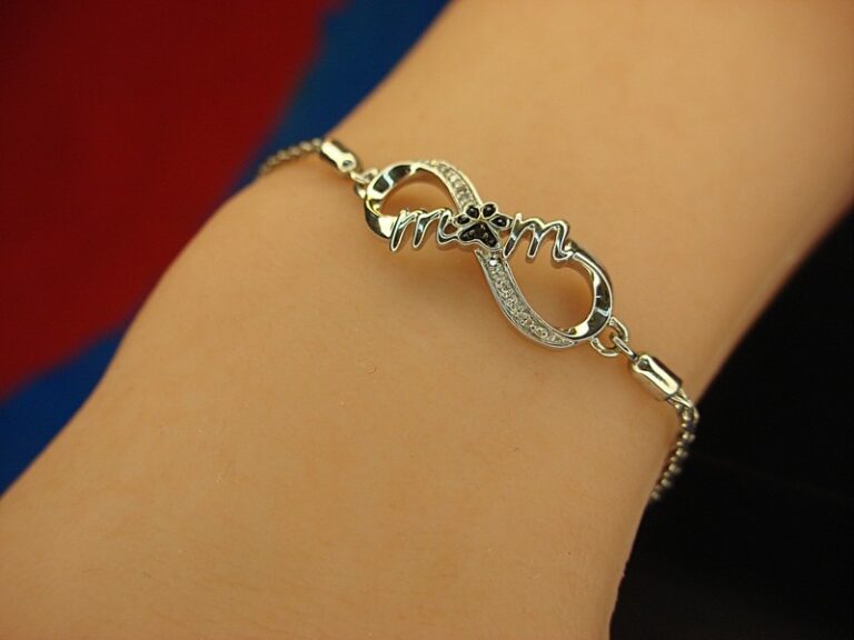 Sterling silver and diamond paw print bracelet engraved with 'MOM'