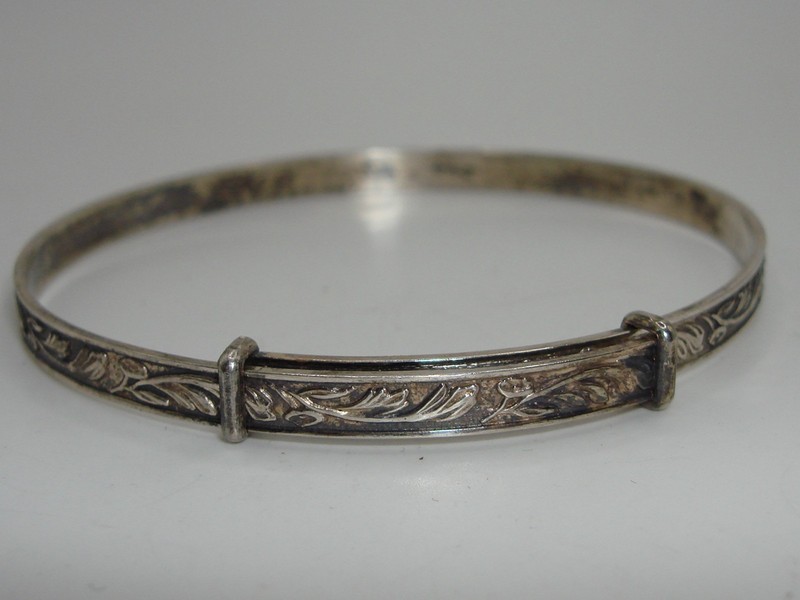Vintage Art Nouveau silver bangle bracelet with floral design