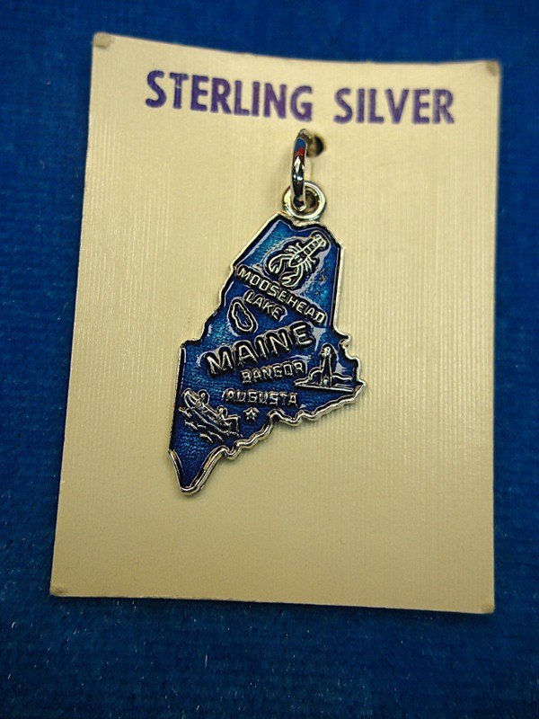 Vintage sterling silver Maine state silhouette enamel charm on card