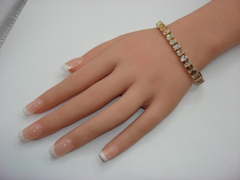 Gold-tone CZ bracelet with sparkling cubic zirconia stones, elegant statement piece