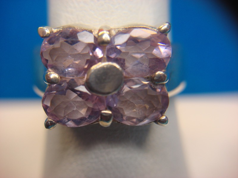 Sterling silver ring with four amethyst gemstones