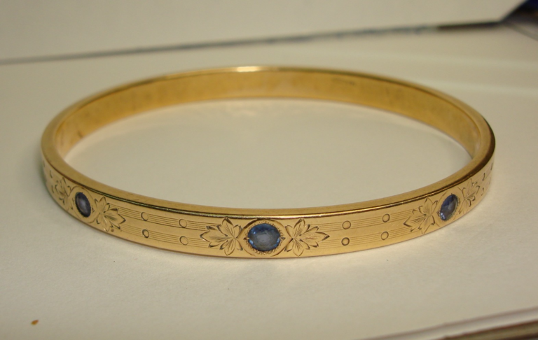 Antique Edwardian 14K gold bangle bracelet with blue sapphires