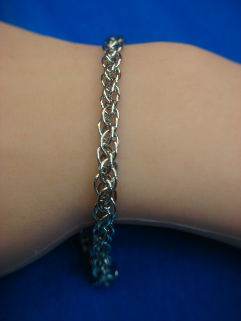 Sterling silver braided link bracelet, pre-owned unworn condition, 7.5 inches