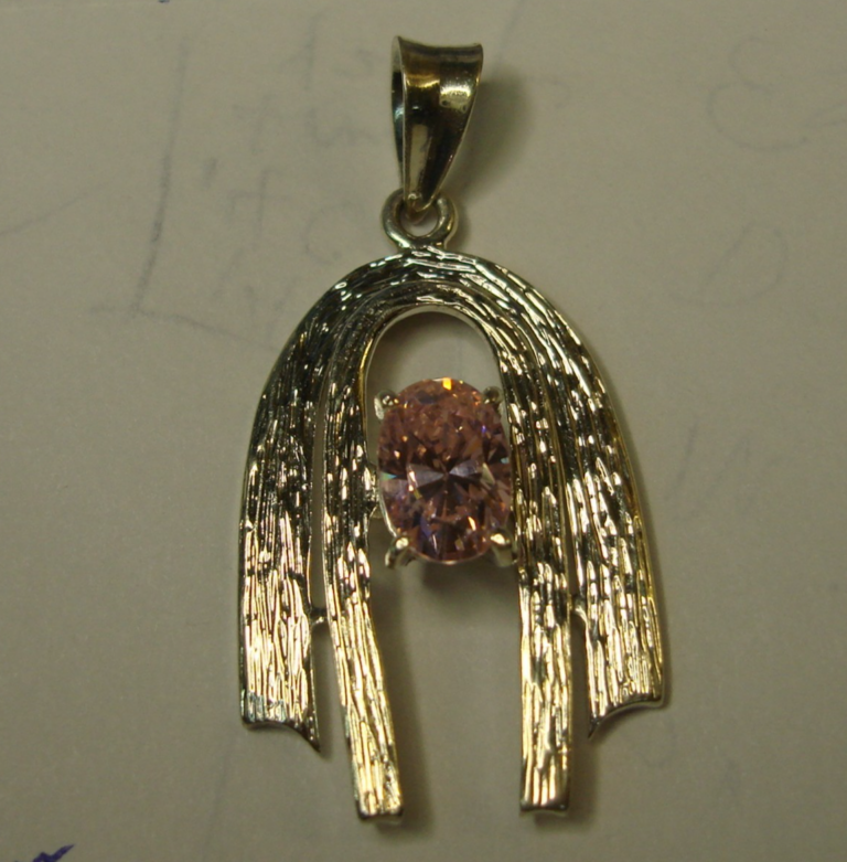 Vintage sterling silver morganite pendant with a vibrant pink oval gemstone, modernist design.