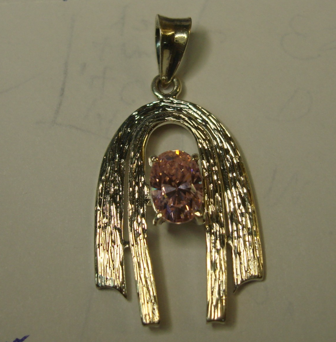Vintage sterling silver morganite pendant with a vibrant pink oval gemstone, modernist design.