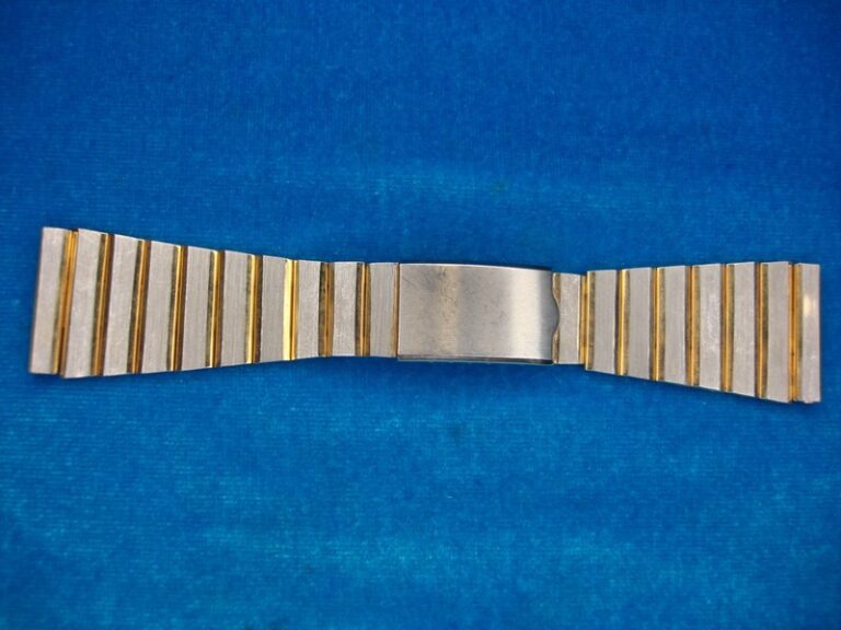 Vintage stainless steel wrist watch band with gold accents
