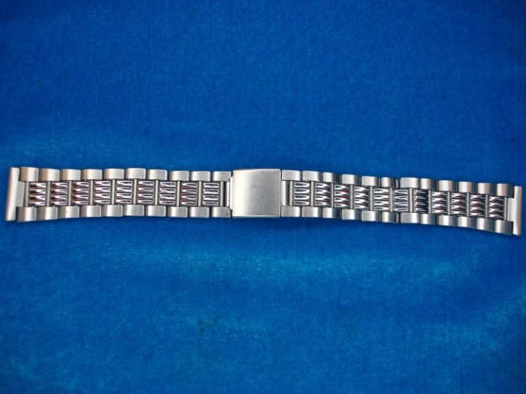 Vintage stainless steel wristwatch band with a fancy design
