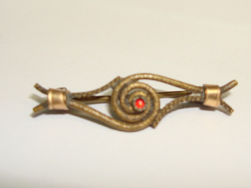 Antique Edwardian wirework love knot pin with red glass cabochon